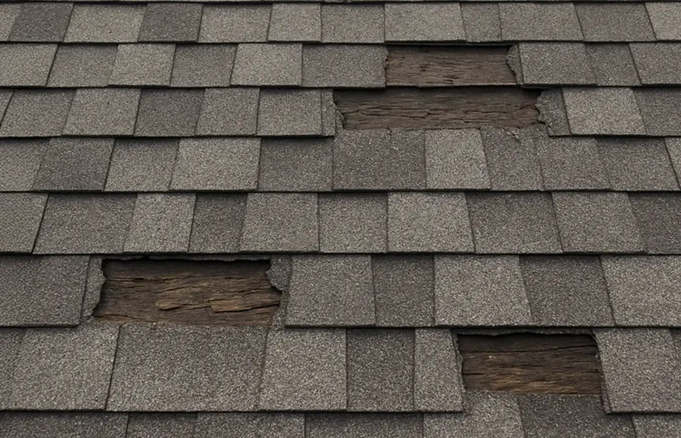 Storm-damaged shingles being repaired by S&S Roofing near Cajah's Mountain, NC