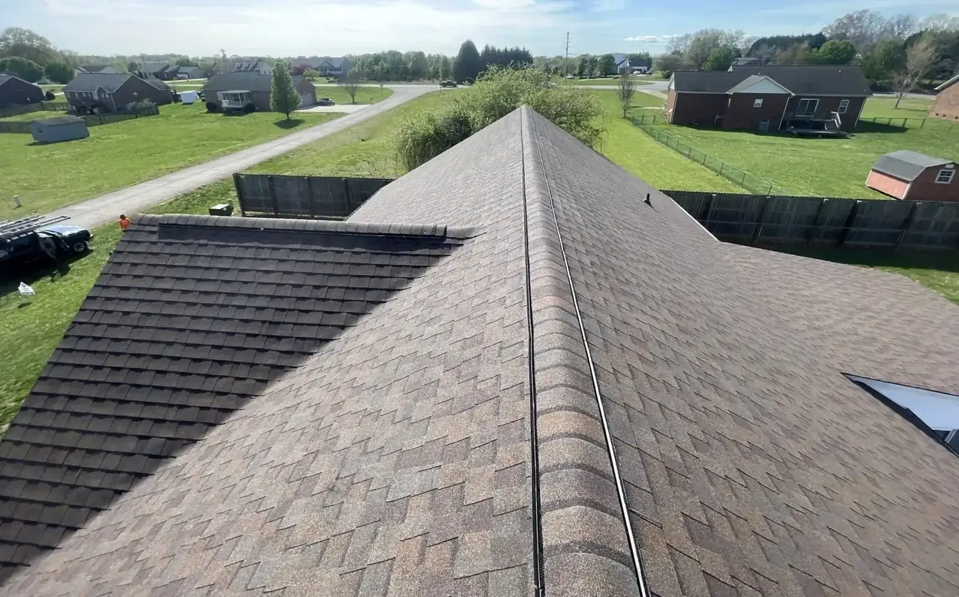 Roof replacement viewed from the ridge cap by S&S Roofing near Cajah's Mountain, NC