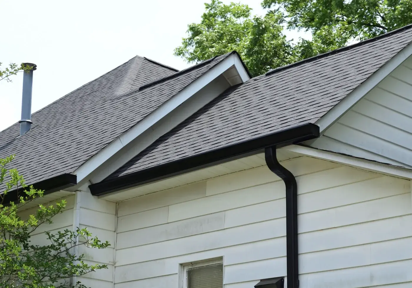 Seamless aluminum gutters and downspout installed by S&S Roofing near Cajah's Mountain, NC