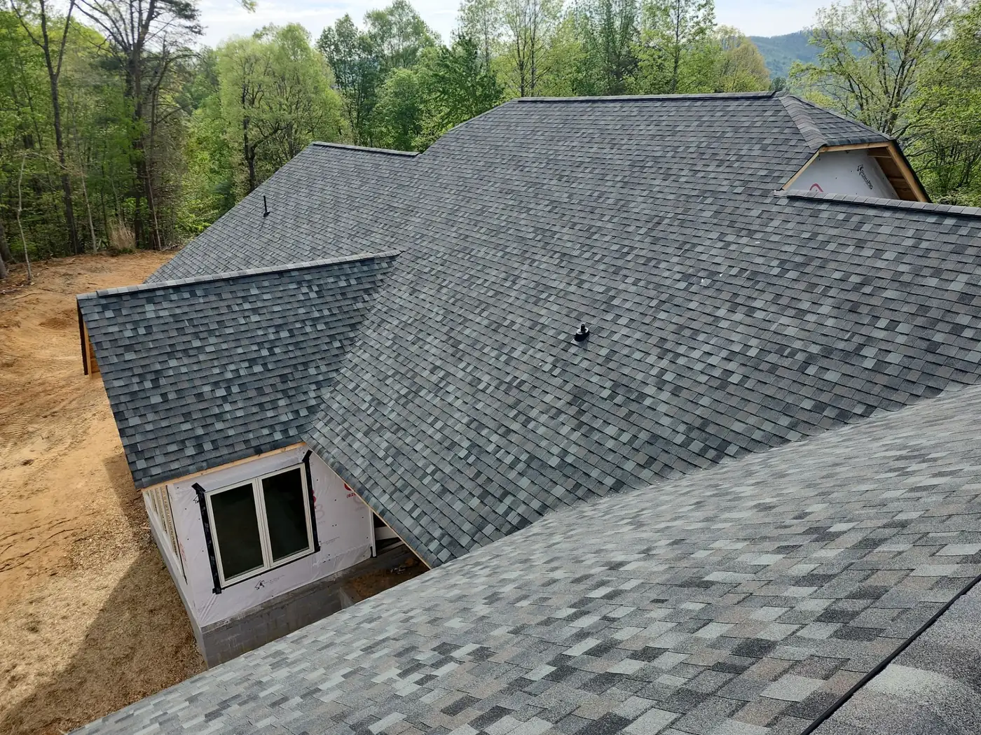 Hip and ridge detail in TAMKO Thunderstorm Grey shingles on a Lenoir, NC new-construction roof by S&S Roofing